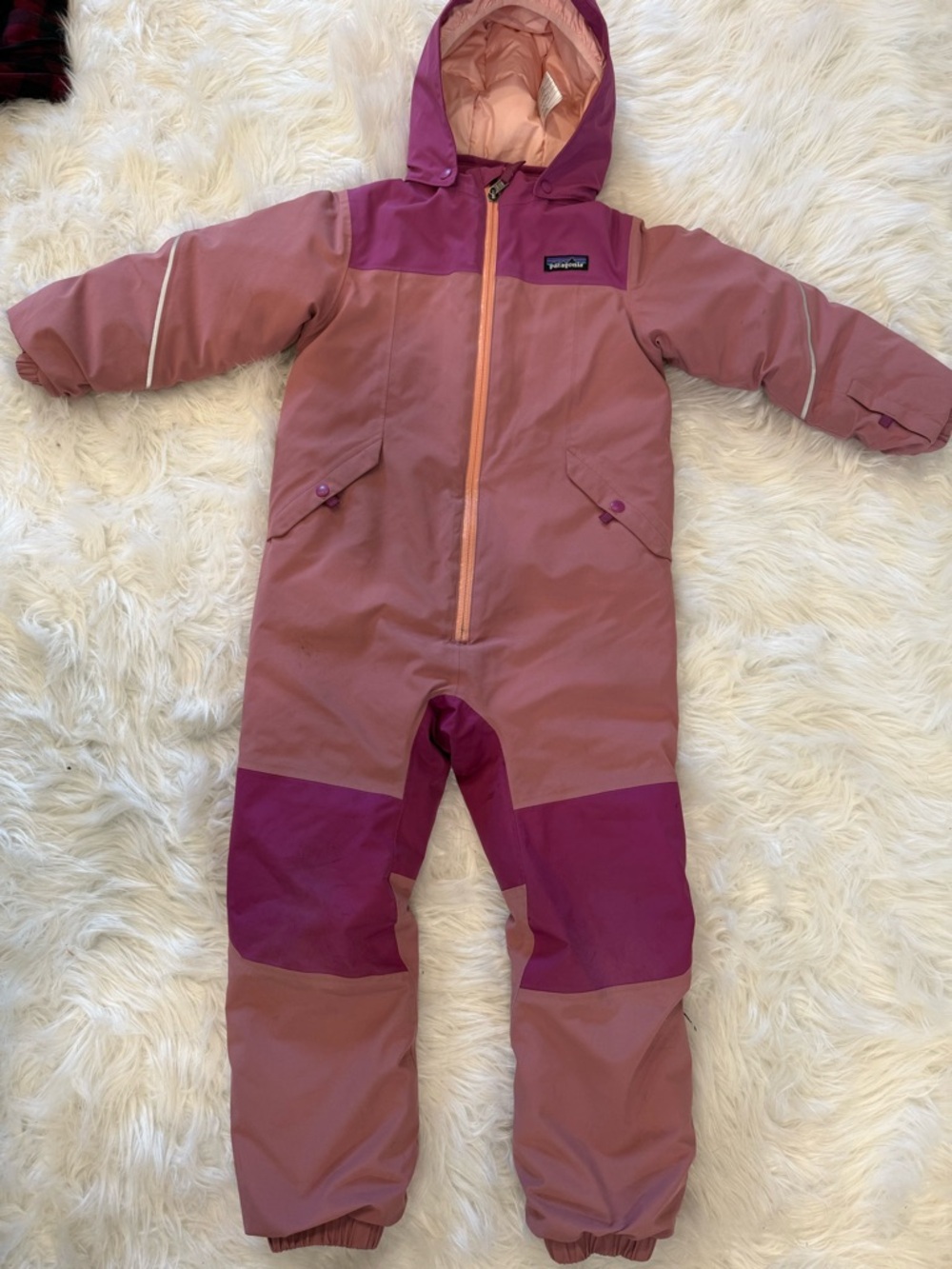 Patagonia kids' snowsuit in light pink and magenta trim